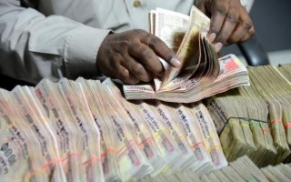 Rupee down 12 paise on dollar demand