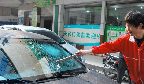 Car windscreen `shattered` by used condom thrown from building