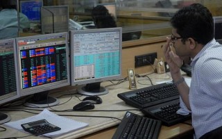 Sensex trades flat during pre-noon session