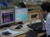 Sensex trades flat during pre-noon trade